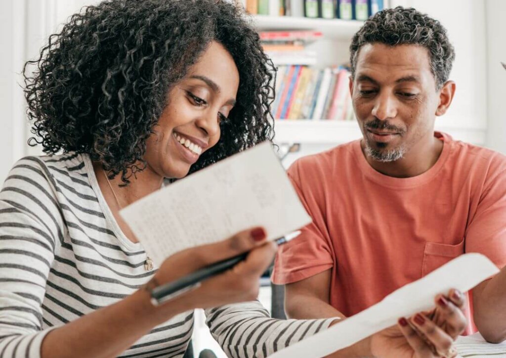 Strategies For Managing Your Money During Times Of Financial Uncertainty couple budgeting