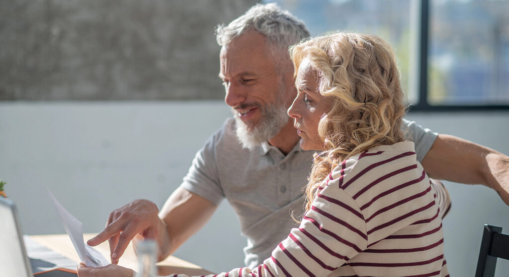 A couple reviews their financial plan A couple reviews their financial plan