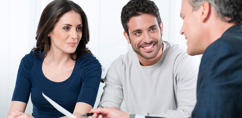 Couple meeting with financial advisor for tax planning